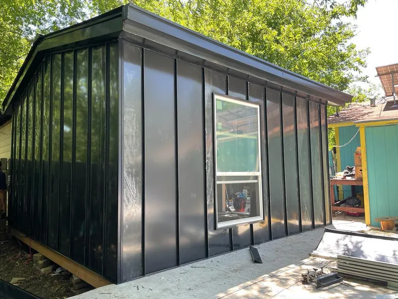 Black standing seam metal wall panels for Metal Roof Installation in Evergreen