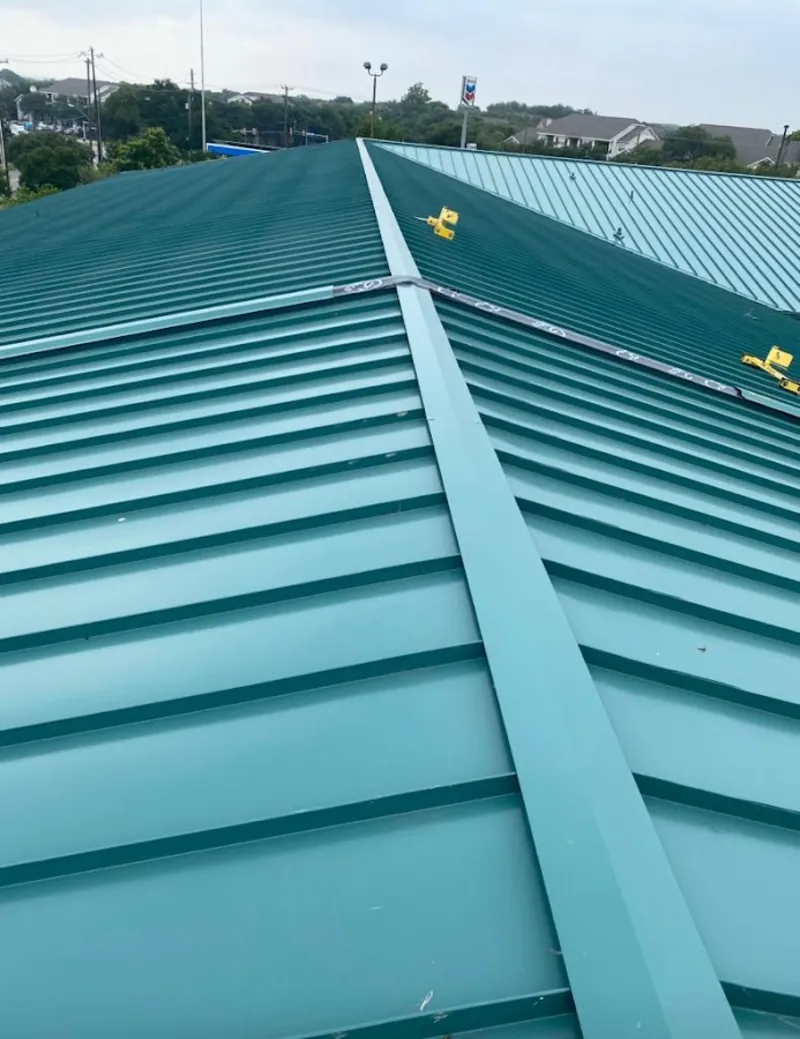 Green commercial metal roof ridge and valley for Metal Roof Repair in Evergreen